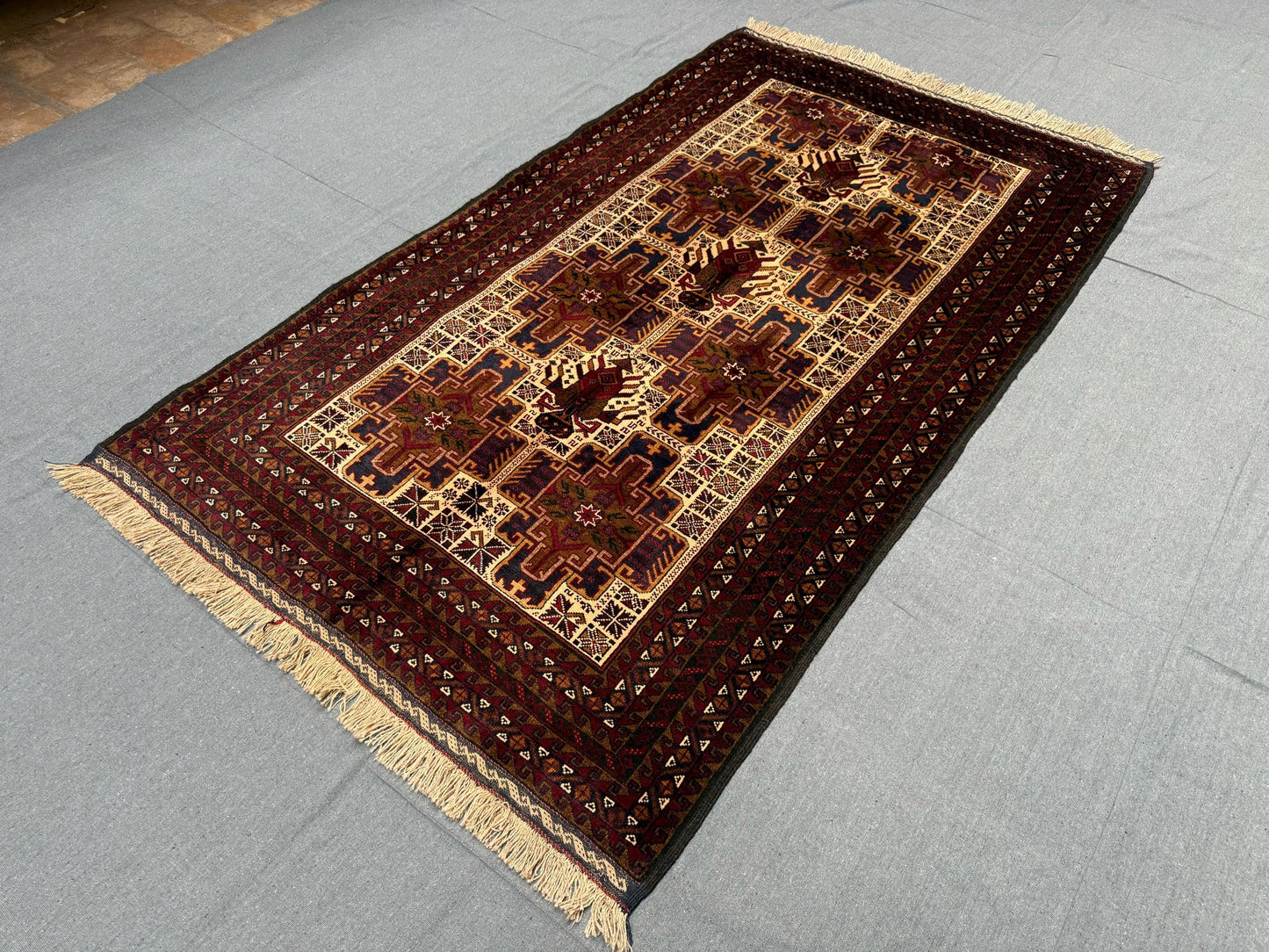 Traditional Baluch Wool Rug – Beige and Burgundy Handwoven Carpet,Bohemian Handmade Baluch Rug – Wool Carpet with Fringe and Ethnic Design.